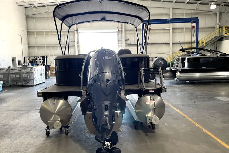 Slide: The Image of 2026 Barletta ARIA 22QC pontoon boat in a warehouse with Yamaha outboard motor. - 9