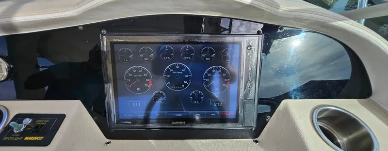 Slide: The Image of Dashboard of 2018 Regal 33 XO boat with digital gauges display. - 22