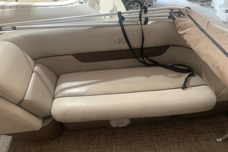 Slide: The Image of 2018 Princecraft Vectra 23 XT boat interior with beige seating and storage. - 10