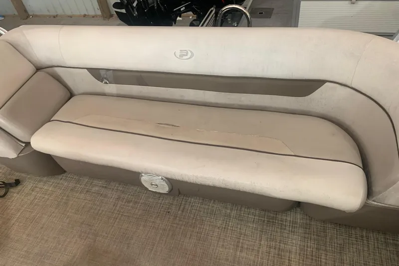 Slide: The Image of 2018 Princecraft Vectra 23 XT boat interior with beige seating and speaker. - 13