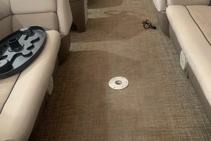 Slide: The Image of Interior of 2018 Princecraft Vectra 23 XT boat with beige seating and carpeted floor. - 17