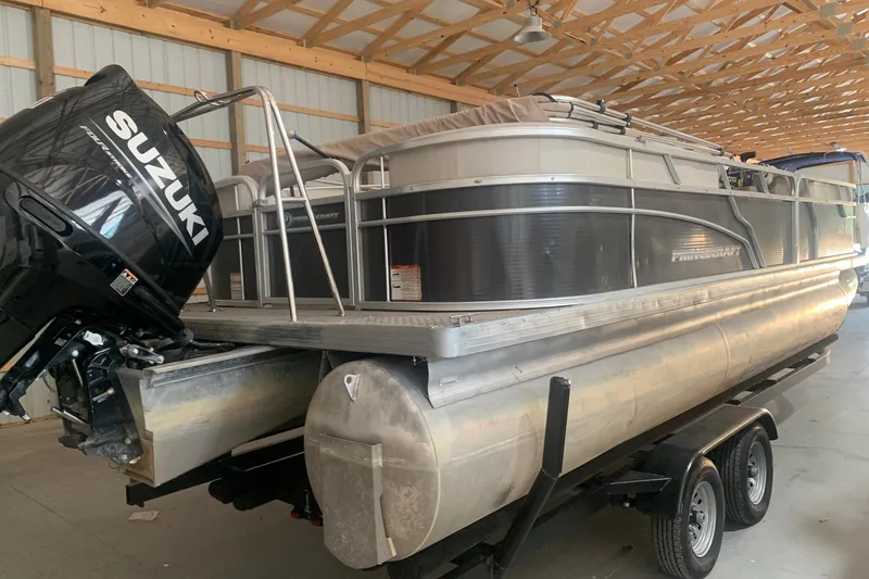 Slide: The Image of 2018 Princecraft Vectra 23 XT pontoon boat with Suzuki outboard motor in a storage facility. - 4