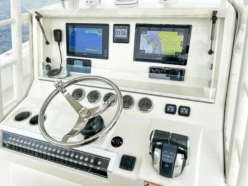 Slide: The Image of 2017 SeaVee 390z Center Console dashboard with navigation screens and controls. - 15