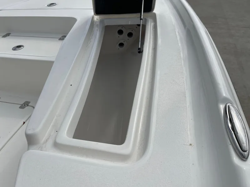 Slide: The Image of 2025 Key West 230 Bay Reef boat storage compartment detail. - 12