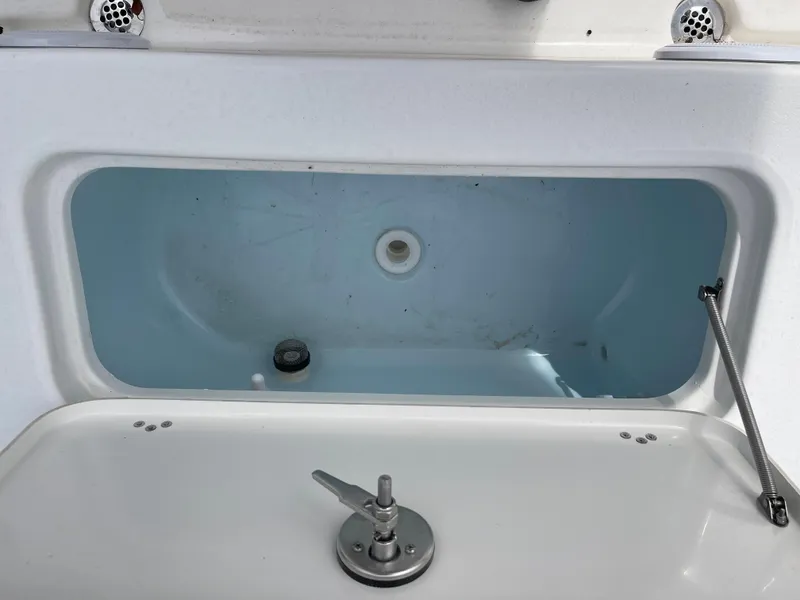 Slide: The Image of Livewell compartment on 2025 Key West 230 Bay Reef boat. - 16