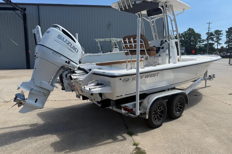 Slide: The Image of 2026 Key West 230 Bay Reef boat with Suzuki engine on a trailer. - 3