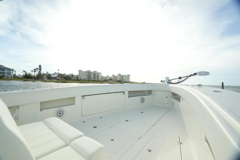 Slide: The Image of 2013 SeaVee 390B boat deck with coastal view and modern seating. - 17