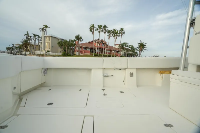 Slide: The Image of 2013 SeaVee 390B boat deck with coastal view and palm trees. - 34