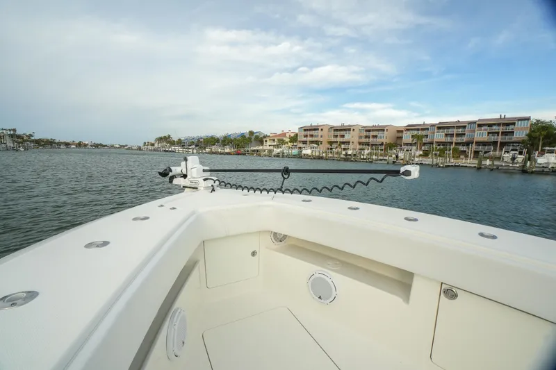Slide: The Image of 2013 SeaVee 390B boat on calm waters near waterfront homes. - 36