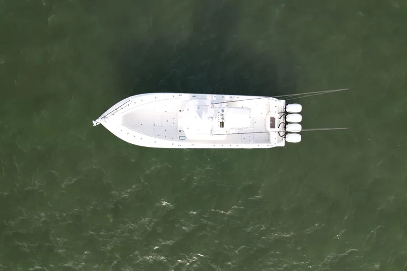 Slide: The Image of Aerial view of 2013 SeaVee 390B boat on green water. - 7