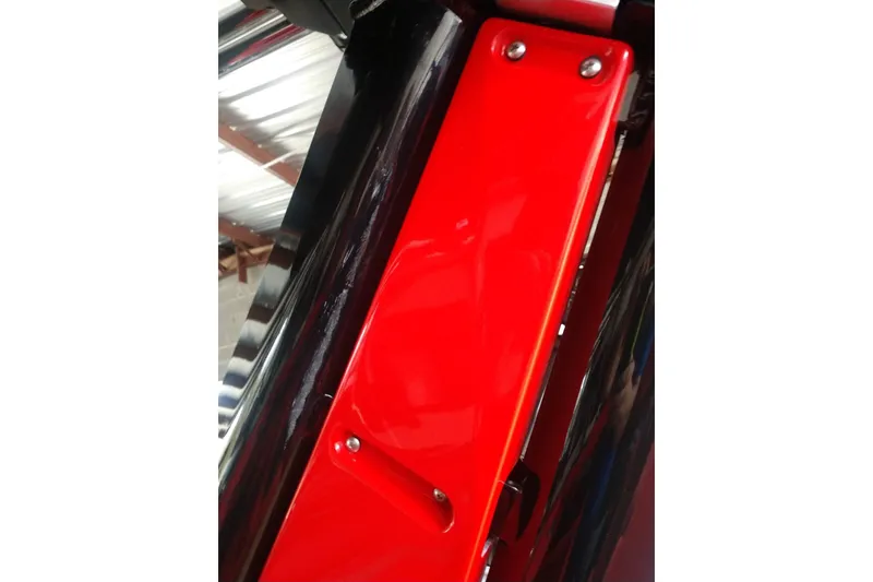 Slide: The Image of Close-up of 2023 Centurion Ri245 boat's red and black metal component. - 3
