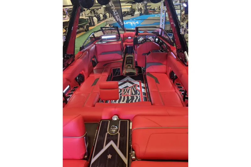 Slide: The Image of 2023 Centurion Ri245 boat interior with luxurious red seating and modern design. - 4