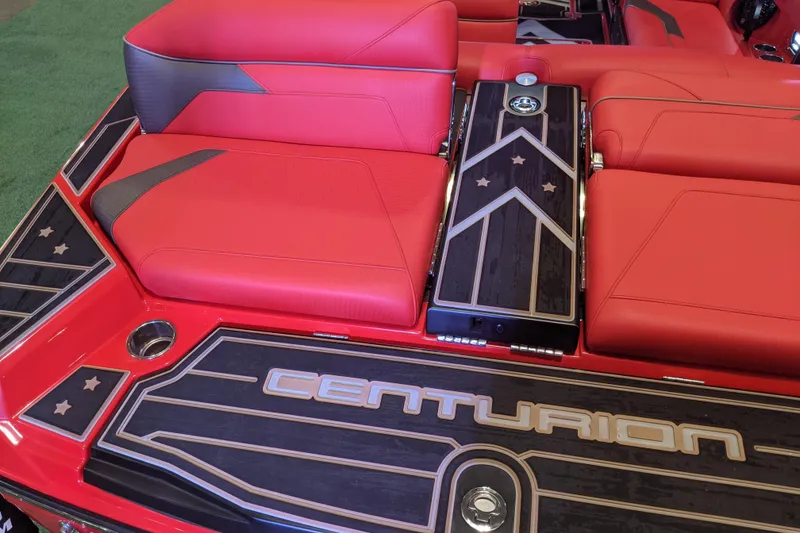 Slide: The Image of 2023 Centurion Ri245 boat interior with red seating and stylish black accents. - 5