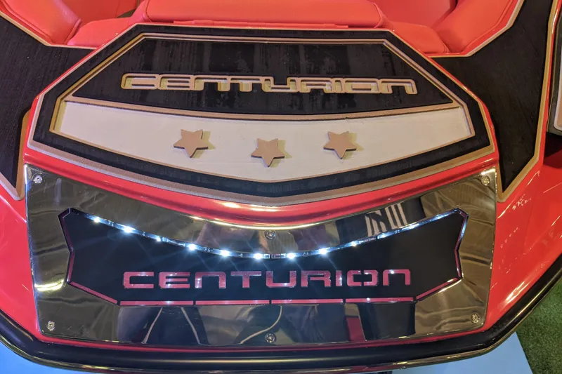 Slide: The Image of 2023 Centurion Ri245 boat with illuminated branding and star accents. - 8