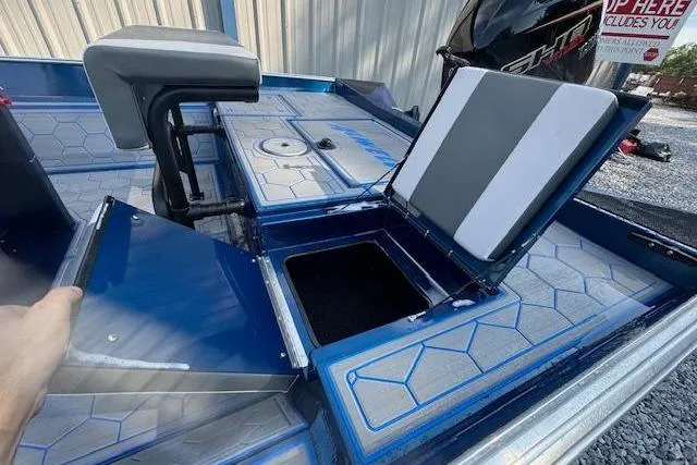 Slide: The Image of 2026 Alweld 2270 Vortex boat interior with open storage compartments and seating. - 12