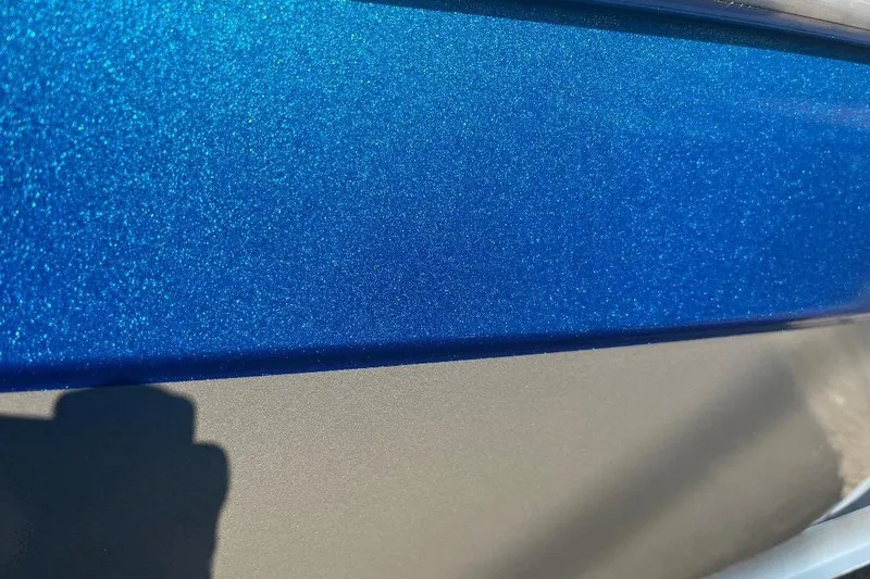 Slide: The Image of Close-up of 2026 Alweld 2270 Vortex boat with metallic blue finish. - 4