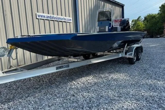 Slide: The Image of 2026 Alweld 2270 Vortex boat on trailer, parked outside Andalusia Marine building. - 6