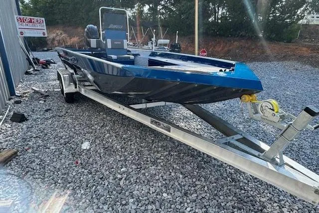 Slide: The Image of 2026 Alweld 2270 Vortex boat on trailer, parked on gravel lot. - 7