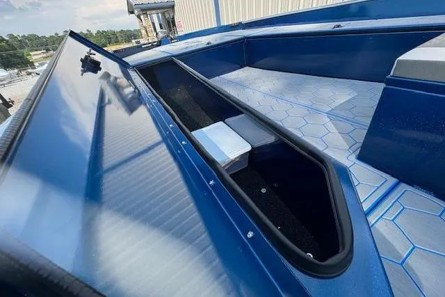 Slide: The Image of 2026 Alweld 2270 Vortex boat with open storage compartment and hexagonal floor pattern. - 9