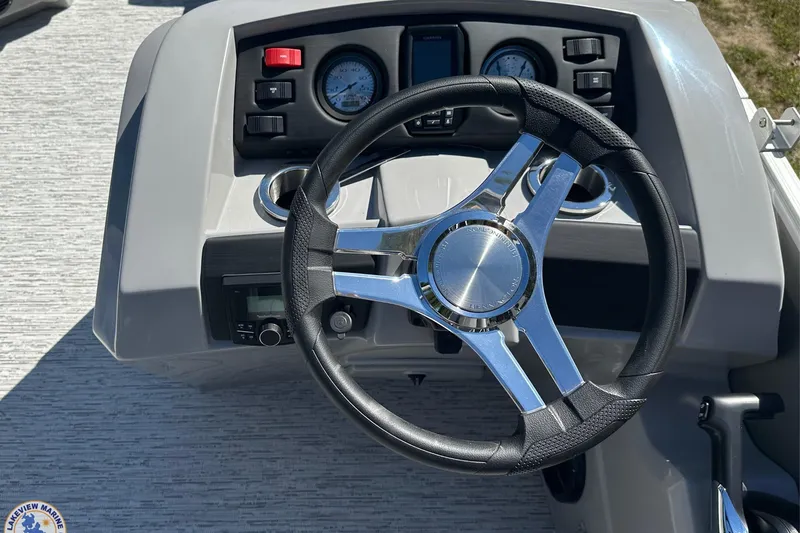 Slide: The Image of Steering console of 2025 Bennington 18 SXL boat with modern controls and gauges. - 4