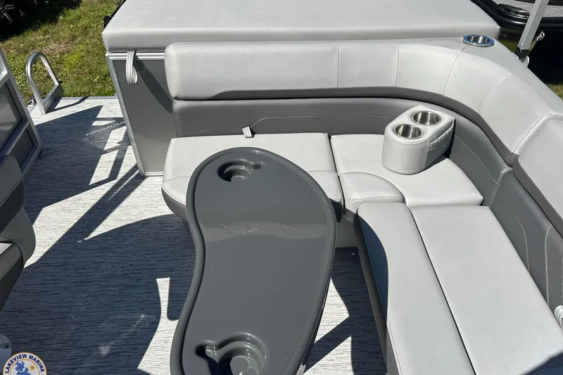 Slide: The Image of 2025 Bennington 18 SXL pontoon boat interior with gray seating and cup holders. - 9