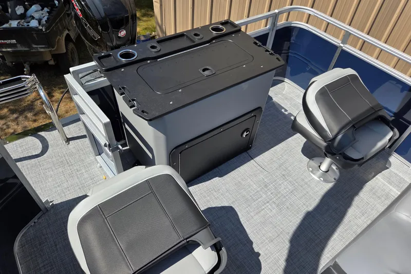 Slide: The Image of 2026 Sun Tracker SportFish 20 DLX boat interior with seating and storage. - 13