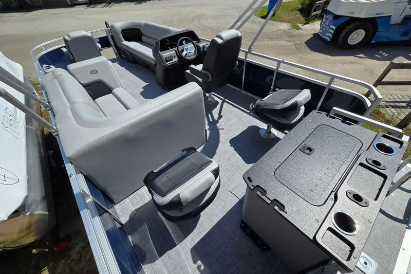 Slide: The Image of 2026 Sun Tracker SportFish 20 DLX pontoon boat interior with seating and control console. - 16