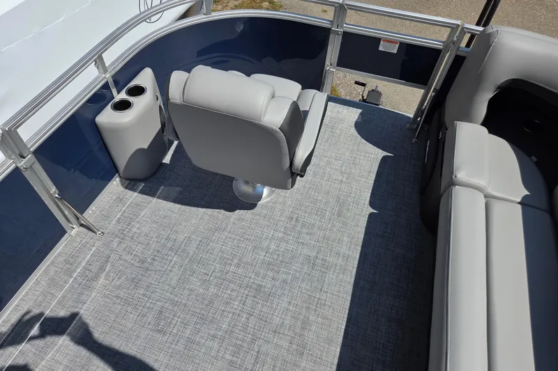 Slide: The Image of 2026 Sun Tracker SportFish 20 DLX interior with gray seating and flooring. - 18