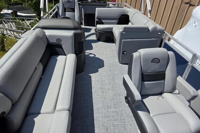 Slide: The Image of 2026 Sun Tracker SportFish 20 DLX pontoon boat with spacious seating and modern design. - 8