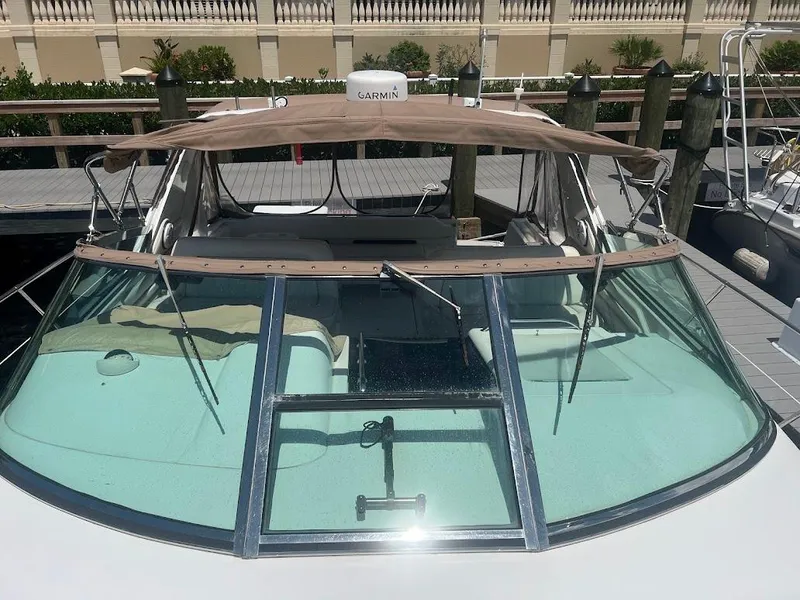 Slide: The Image of 1996 Sea Ray 400 Sundancer yacht docked, featuring a Garmin navigation system. - 3