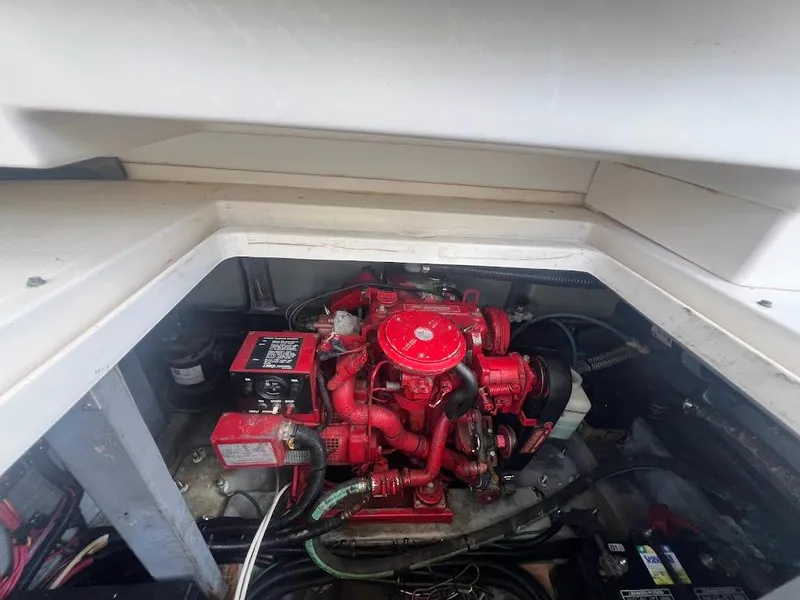 Slide: The Image of Engine compartment of a 1996 Sea Ray 400 Sundancer with a red engine. - 8