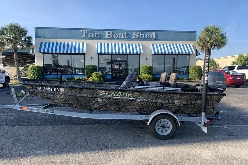 Slide: The Image of 2020 SeaArk RX 170 boat on trailer outside The Boat Shed dealership. - 0