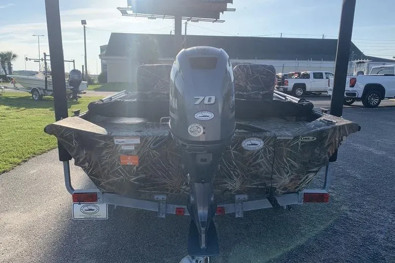 Slide: The Image of 2020 SeaArk RX 170 boat with camouflage design and 70 HP outboard motor. - 2