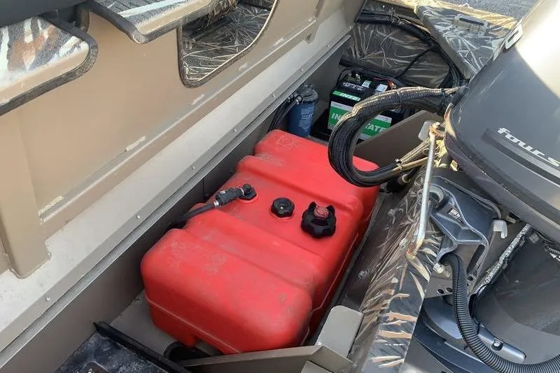 Slide: The Image of Interior of a 2020 SeaArk RX 170 boat showing fuel tank and engine components. - 8