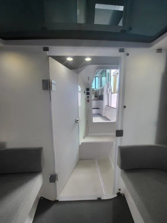 Slide: The Image of Interior of 2024 Axopar 37 XC CROSS CABIN, featuring modern design and comfortable seating. - 28