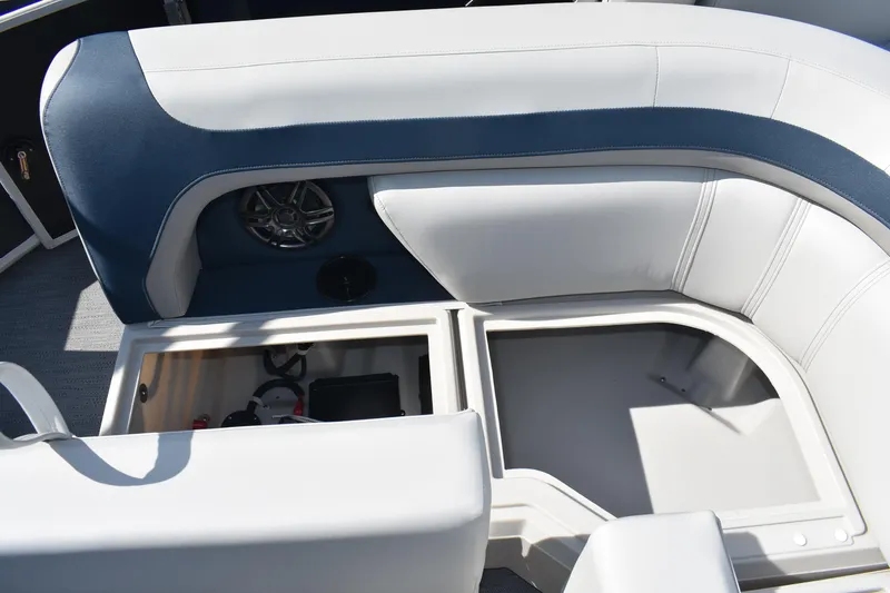 Slide: The Image of 2026 Godfrey Sweetwater 2086 C boat seating with storage compartments and speaker. - 12