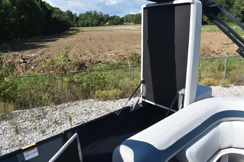 Slide: The Image of 2026 Godfrey Sweetwater 2086 C boat interior with open storage compartment, outdoor setting. - 13