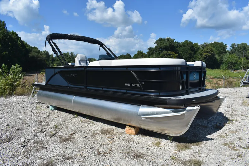 Slide: The Image of 2026 Godfrey Sweetwater 2086 C pontoon boat on gravel, under blue sky. - 5