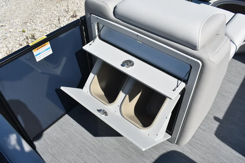 Slide: The Image of 2026 Godfrey Sweetwater 2086 C boat storage compartment with open hatch and dual bins. - 8