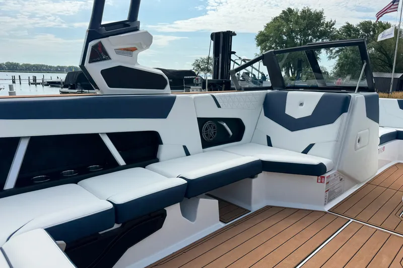 Slide: The Image of 2026 Nautique Super Air Nautique GS22 interior with sleek seating and modern design. - 19