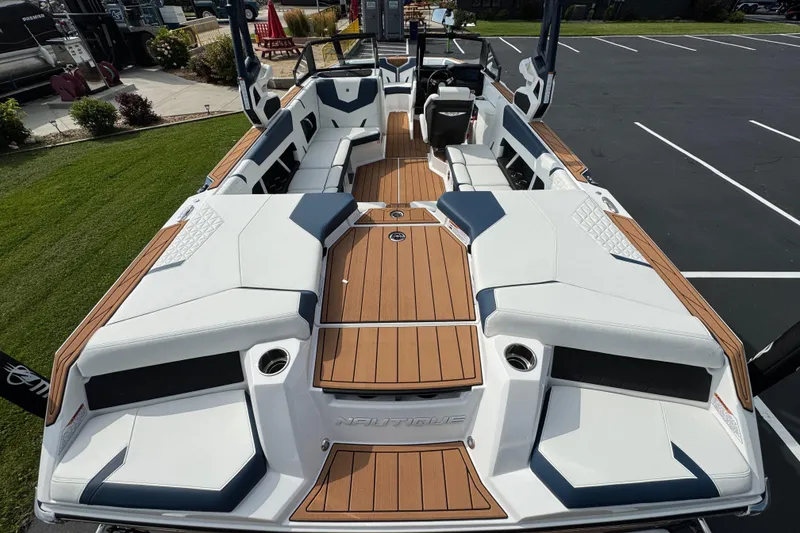 Slide: The Image of 2026 Nautique Super Air Nautique GS22 boat interior with sleek seating and modern design. - 6