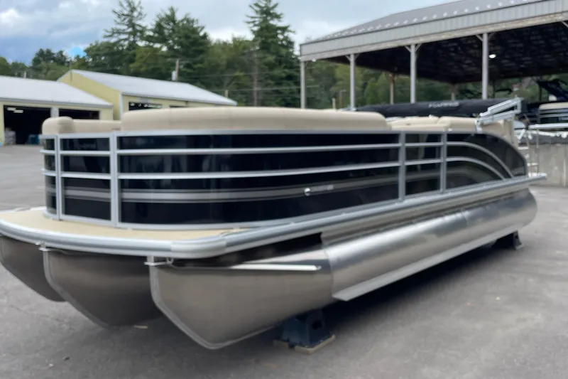 The Image of 2026 Harris Cruiser 230 pontoon boat in a marina setting, showcasing sleek design. - 0