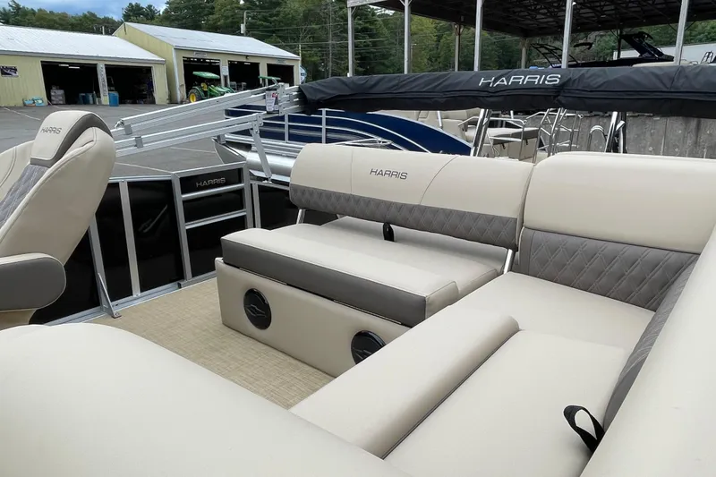 Slide: The Image of 2026 Harris Cruiser 230 pontoon boat with luxurious seating and sleek design. - 4