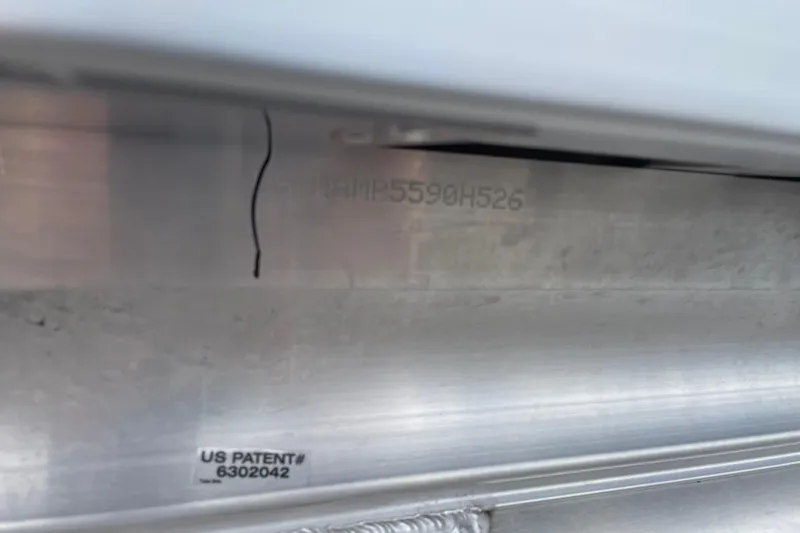 Slide: The Image of 2026 Harris Cruiser 230 hull with visible US patent number 6302042. - 6