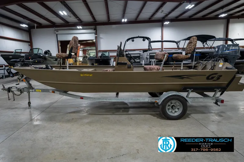Slide: The Image of 2007 G3 1860 CCT boat on trailer in indoor showroom setting. - 10