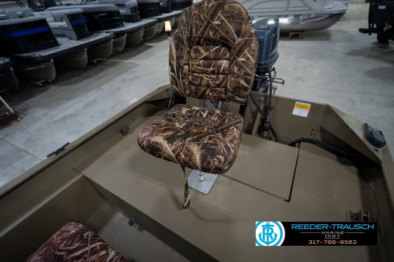Slide: The Image of 2007 G3 1860 CCT boat with camo seat, displayed indoors at Reeder-Trausch Marine. - 24