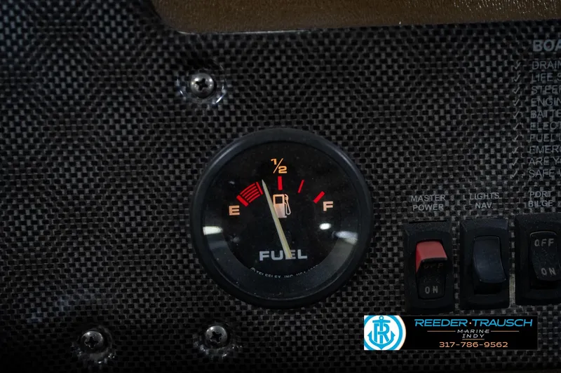 Slide: The Image of Fuel gauge on 2007 G3 1860 CCT boat dashboard with control switches. - 32