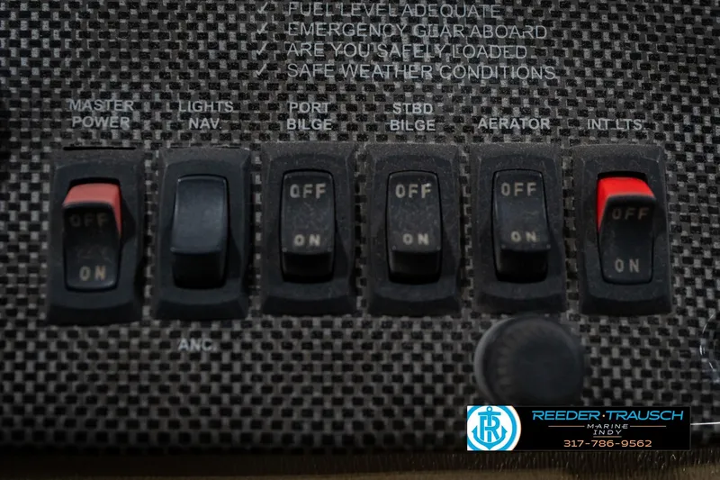 Slide: The Image of Control panel of a 2007 G3 1860 CCT boat with various switches and labels. - 33