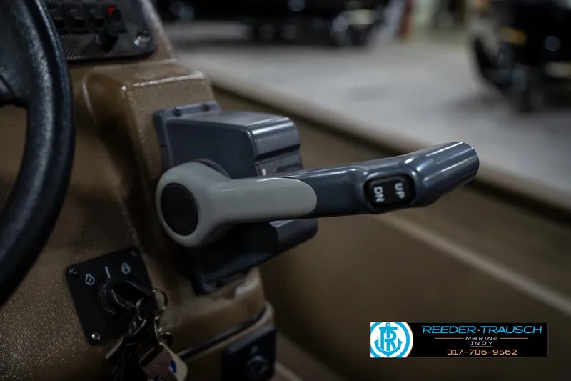 Slide: The Image of Close-up of a 2007 G3 1860 CCT boat throttle control with steering wheel. - 34