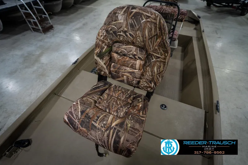 Slide: The Image of 2007 G3 1860 CCT boat with camo seat, displayed indoors at Reeder Trausch Marine. - 38